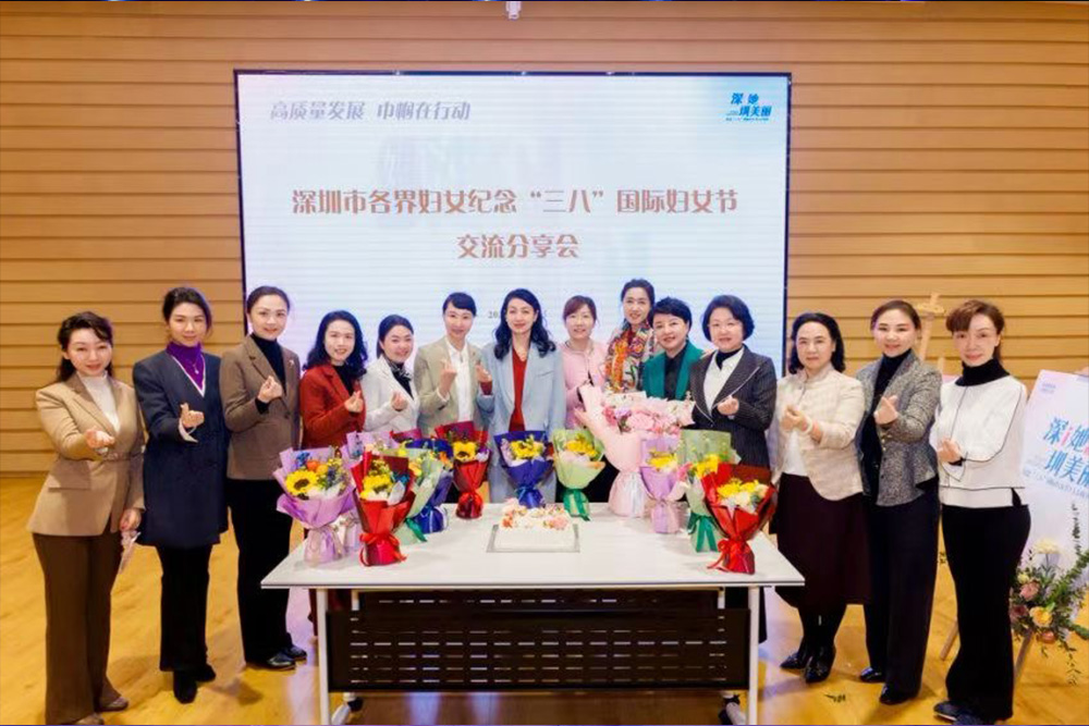 FILMBASE's Lanlan Yuan poses for a photo with members of the Longgang Women's Federation.jpg